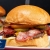 [Image: ¡Paga $14 en Lugar de $25.50 por 2 Hamburguesas Classic Cheeseburger: 1/3 Lb de Carne de Res con Bacon, Mushrooms o Jalapeños + 2 Complementos a Elección entre Papas, Aros de Cebolla, Mac and Cheese, Pepinillos Fritos y Otros + 2 Sodas con Refill!m]