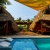 [Image: ¡Paga Q365 en Vez de Q850 por 1 Noche para 2 Personas en Cabaña Tipo Hawaii + Uso de Instalaciones: Tapetes de Playa, Piscina, Hamacas y Más!m]
