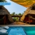 [Imagen:¡Paga Q549 en Vez de Q999 por Estadía para 2 Personas en Cabaña Tipo Hawaii con Baño Privado + 2 Cócteles de Bienvenida + Uso de Instalaciones: Tapetes de Playa, Piscina, Hamacas y Más!]